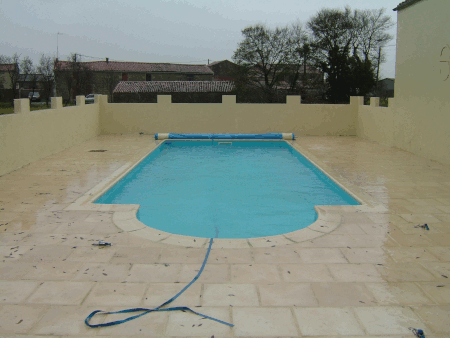10m x 5m inground outdoor pool with round steps and stone slabs
