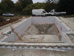 pool built near old barn with deep end