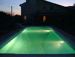 outdoor inground pool built on riverbank