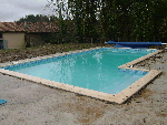 large outdoor pool built with greek end on longside of pool