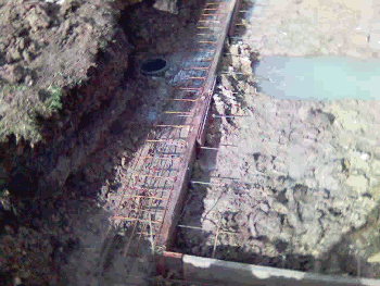 Inground Pool With Adjacent Stream Requires Drainage Systems