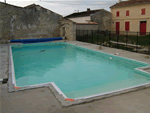 outdoor inground pool with square roman end